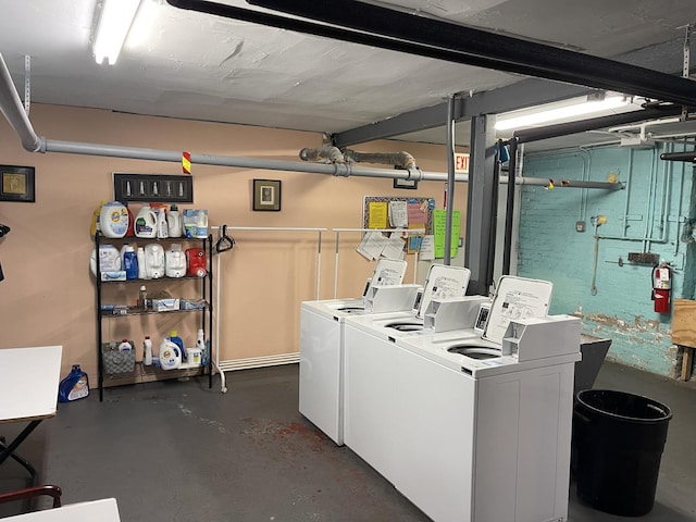 community laundry room with separate washer and dryer