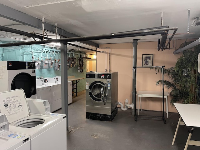 unfinished basement featuring washer and clothes dryer