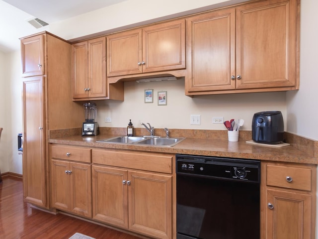 kitchen featuring dark wood-style floors, visible vents, brown cabinetry, a sink, and dishwasher