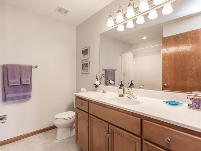 bathroom featuring visible vents, baseboards, toilet, tile patterned flooring, and vanity