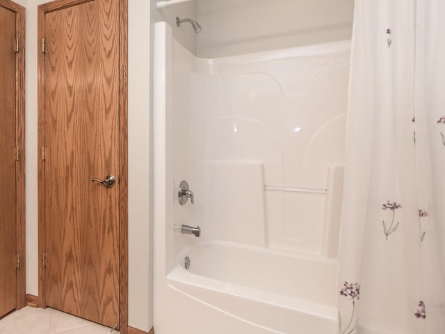 full bath featuring shower / bathtub combination with curtain and tile patterned floors