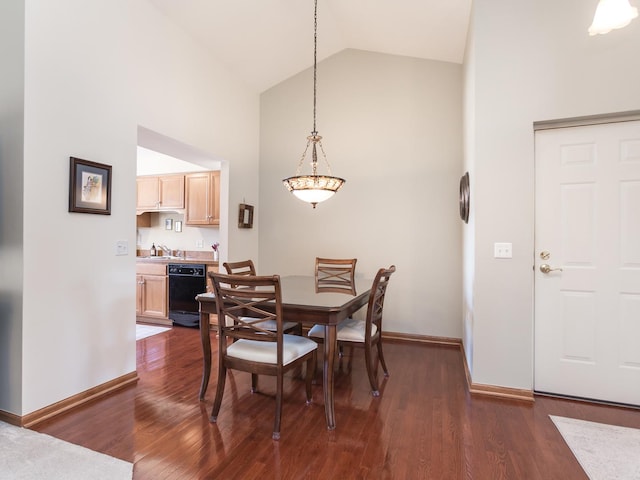 dining room featuring high vaulted ceiling, dark wood-style flooring, and baseboards