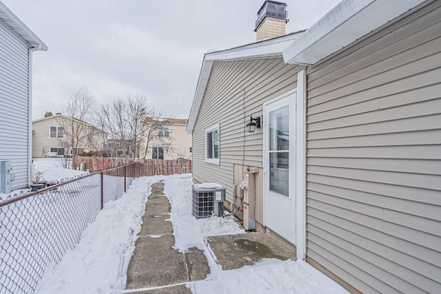 exterior space featuring cooling unit and a fenced backyard