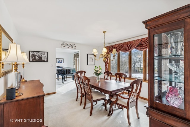 7821 Teton Rd, Orland Park, IL 60462 - dining area with light carpet and a chandelier