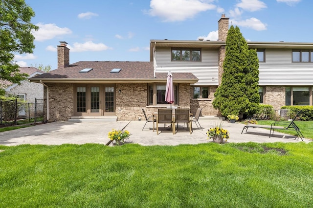 7821 Teton Rd, Orland Park, IL 60462 - back of property with brick siding, a chimney, a patio, and french doors