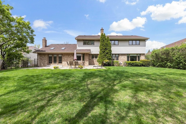 7821 Teton Rd, Orland Park, IL 60462 - rear view of property featuring a patio area, french doors, a chimney, and brick siding