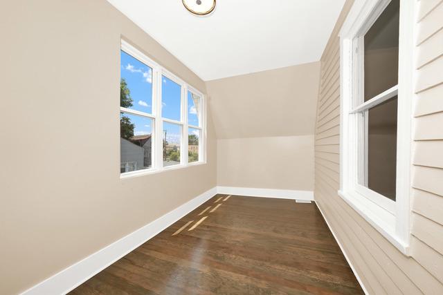 additional living space featuring lofted ceiling, baseboards, and dark wood-style flooring