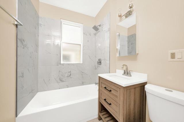 full bathroom with shower / bath combination, vanity, and toilet