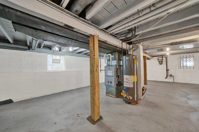 basement with heating unit and water heater