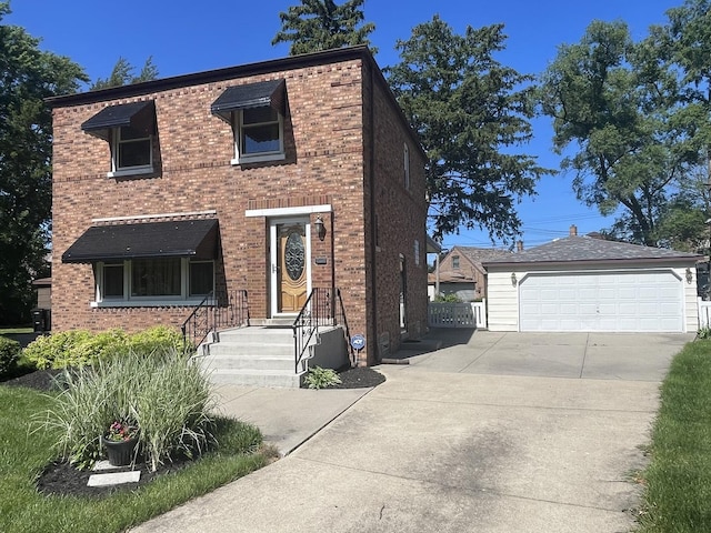 view of front of house featuring a garage, brick siding, and an outdoor structure