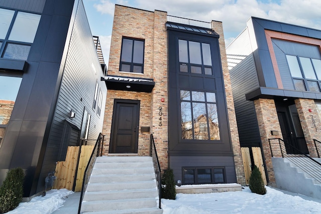 contemporary house with brick siding