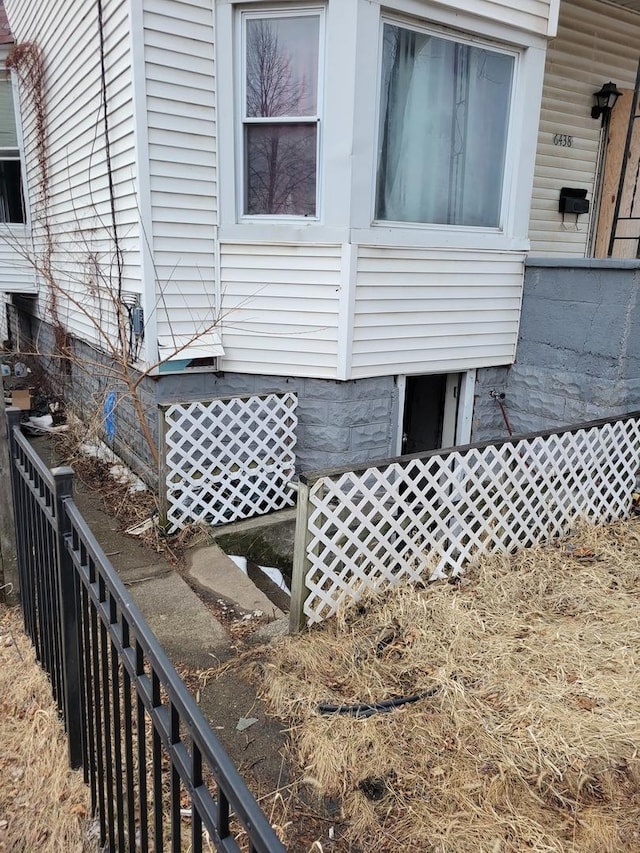 view of home's exterior featuring fence