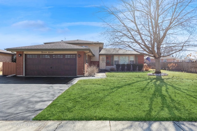 ranch-style house with a garage, fence, and driveway