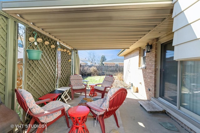 view of patio / terrace featuring fence