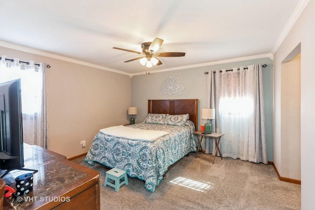 carpeted bedroom featuring baseboards, ornamental molding, and a ceiling fan