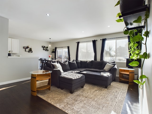 living room with recessed lighting, wood finished floors, and baseboards