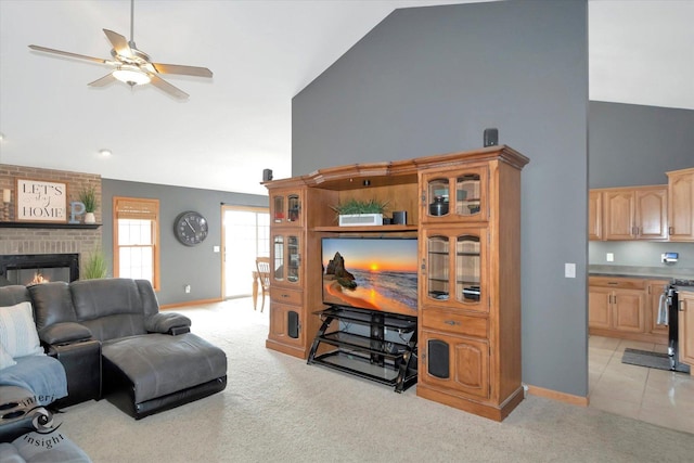 living area featuring light carpet, a fireplace, and high vaulted ceiling