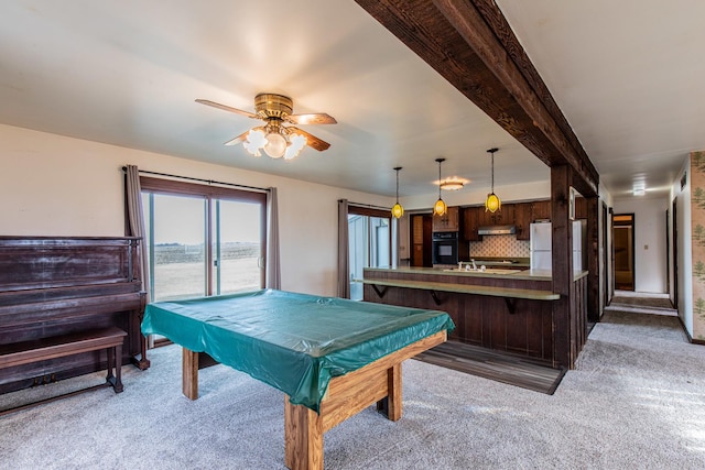 rec room featuring light colored carpet, pool table, a ceiling fan, a sink, and beamed ceiling