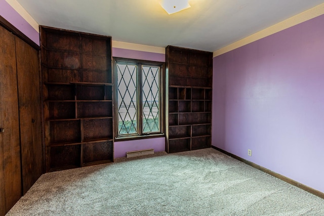 empty room with baseboards, visible vents, and carpet flooring