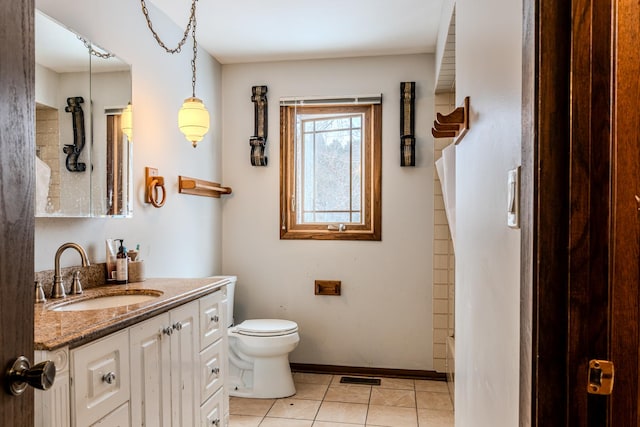 full bath featuring visible vents, toilet, vanity, baseboards, and tile patterned floors