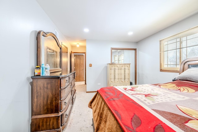 bedroom featuring recessed lighting, baseboards, and light colored carpet