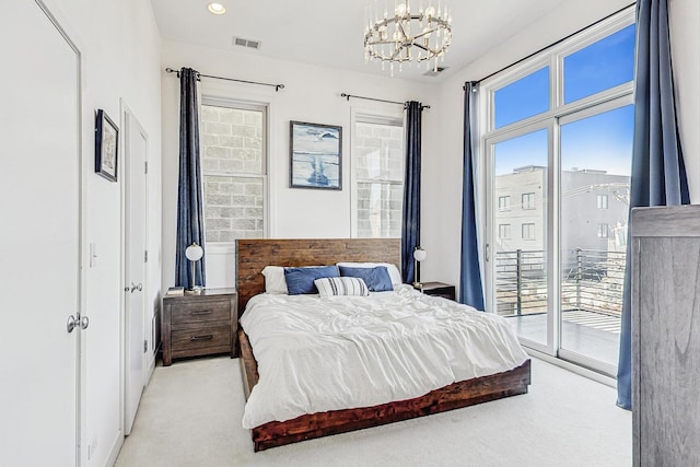 bedroom featuring access to exterior, visible vents, light carpet, recessed lighting, and a notable chandelier