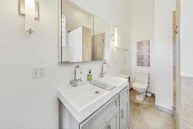 full bathroom with tiled shower, double vanity, a sink, tile patterned flooring, and toilet