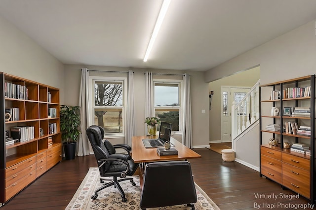 office with dark wood-style floors and baseboards