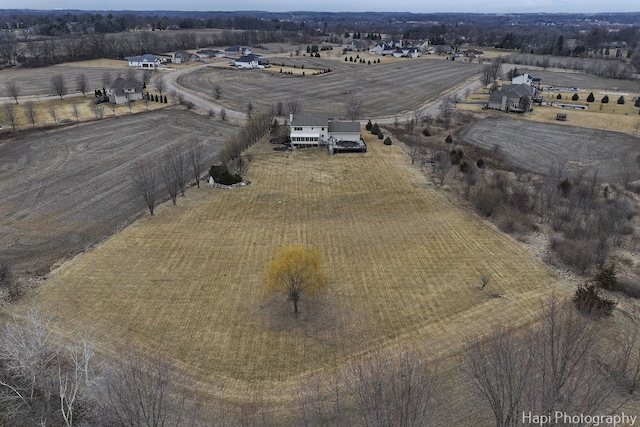 birds eye view of property featuring a rural view