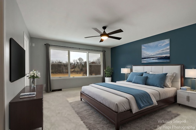 carpeted bedroom with a ceiling fan