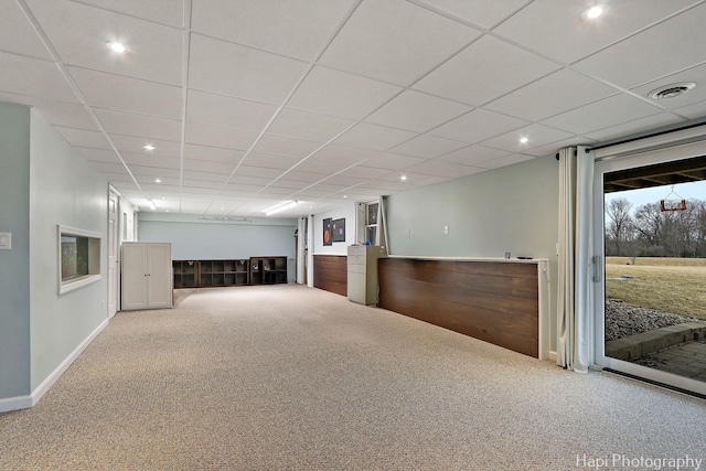 interior space with a paneled ceiling, carpet, visible vents, and recessed lighting