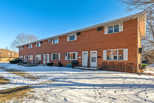 view of front of home featuring brick siding