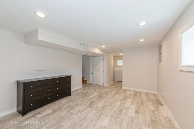 below grade area featuring recessed lighting, light wood-style flooring, stairway, washer / dryer, and baseboards