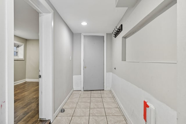 hall with light tile patterned floors, recessed lighting, and baseboards