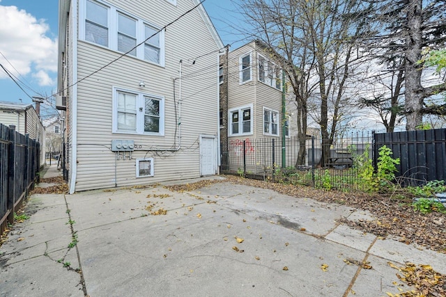 back of house featuring a patio and a fenced backyard