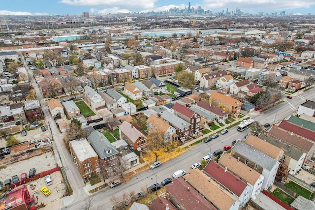 birds eye view of property with a city view