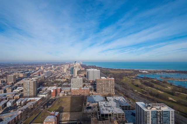 drone / aerial view featuring a view of city and a water view