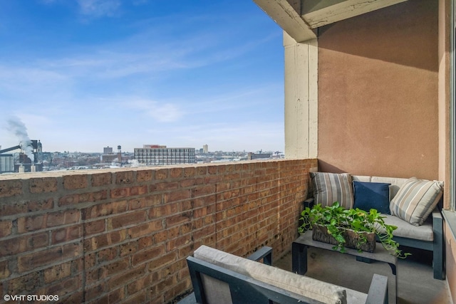 balcony with an outdoor hangout area and a city view