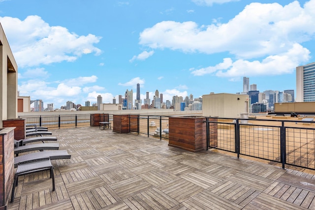 view of patio with a balcony and a view of city