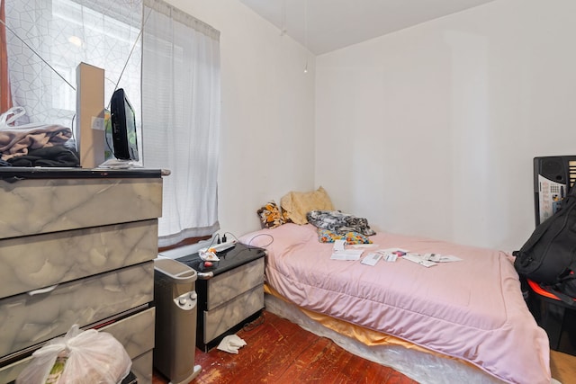 bedroom featuring dark wood-type flooring