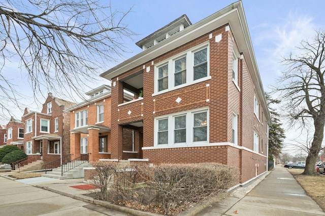 traditional style home with brick siding