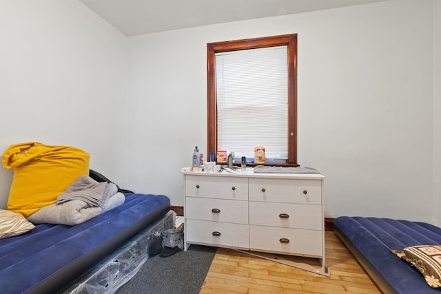 bedroom featuring light wood-style flooring