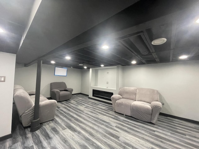 living room featuring wood finished floors and baseboards