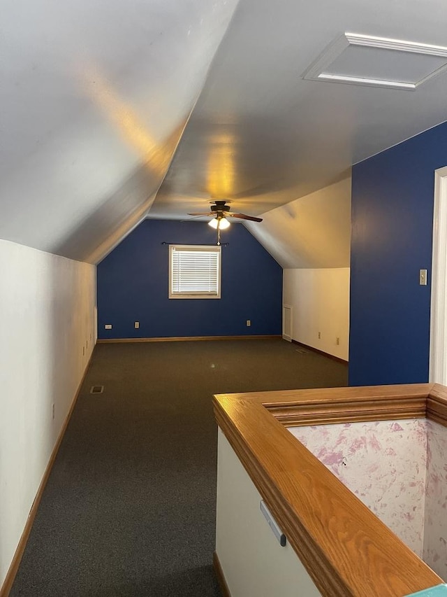 bonus room with visible vents, a ceiling fan, carpet flooring, vaulted ceiling, and baseboards