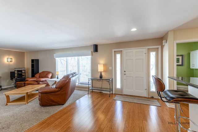 entrance foyer with recessed lighting, light wood-type flooring, and baseboards