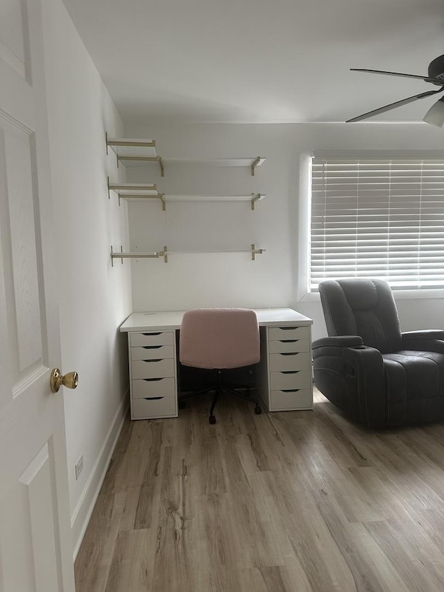 office with ceiling fan, baseboards, and light wood-style floors