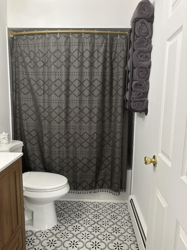 bathroom featuring toilet, shower / tub combo, vanity, baseboard heating, and tile patterned floors