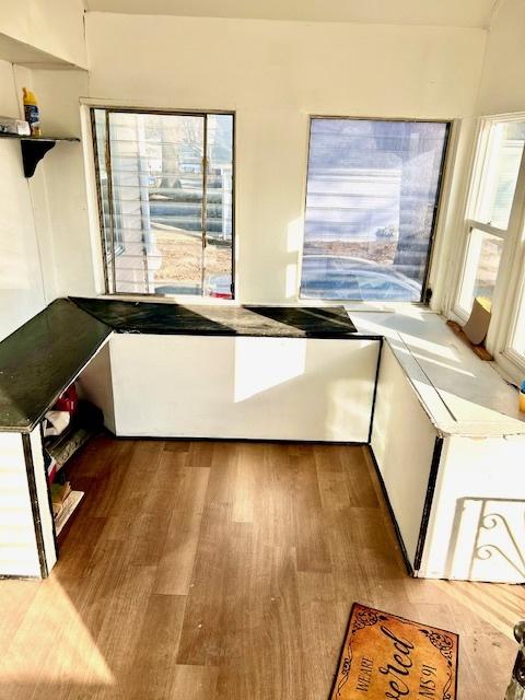 unfurnished dining area with light wood finished floors