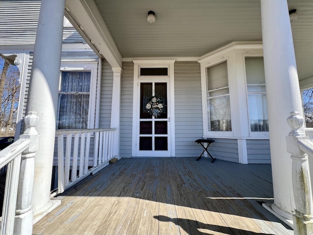 wooden deck featuring covered porch