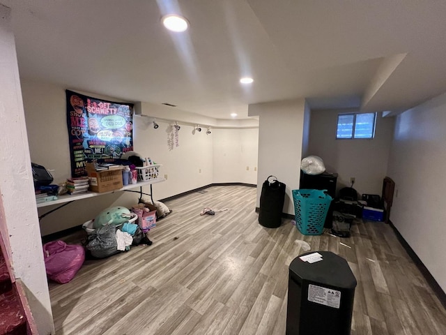 game room with baseboards, wood finished floors, and recessed lighting